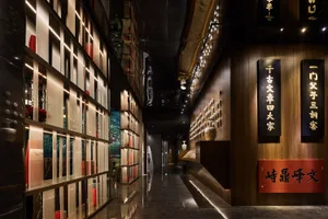 A beautifully designed corridor interior with wooden walls and shelves displaying various decorative items.