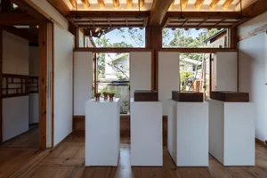 A minimalist interior space featuring white wood elements.
