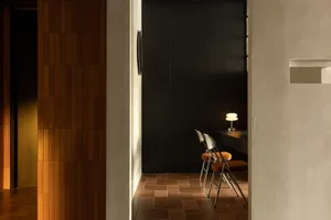 A minimalist interior design showcasing wooden elements and a warm, cozy atmosphere.