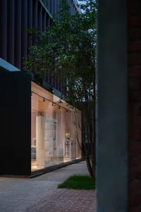 A minimalist storefront with glass walls.
