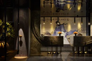 An elegant lobby with marble walls and floor