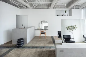 Minimalist design with concrete floor and clean lines.