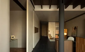 A modern reception area with concrete and wooden elements.