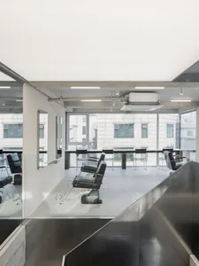 A modern hair salon interior with metallic accents.