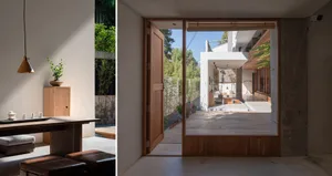 A modern, minimalist interior featuring wooden elements and a connection to the outdoors.