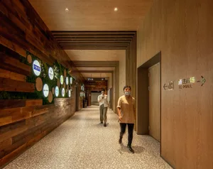 A spacious, industrial-themed commercial interior with wood accents and modern fixtures.
