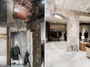 Industrially designed retail space featuring concrete walls and integrated furniture
