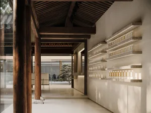 A retail storefront with wooden beams, concrete walls, and warm lighting.