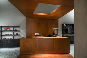 Modern retail shop with concrete, wood, and glass materials