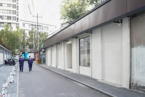 Concrete storefronts along an urban street
