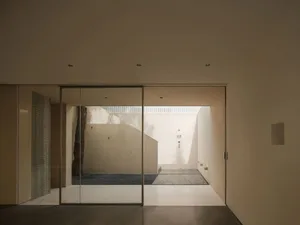 A minimalist living space with a white interior and clean lines.