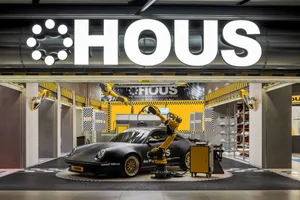 Automotive-themed retail exhibition with metallic black design elements