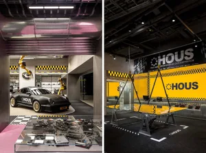 Modern industrial retail space featuring metallic design elements and a black and yellow color scheme.
