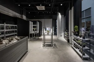 Industrial-themed retail store with metal shelving and display cases