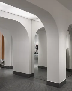 Modern retail store with minimalist design and concrete walls and floors.
