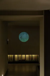 Modern interior design hallway with a backlit round window.