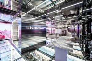 A modern retail storefront featuring glass and metal composite materials.