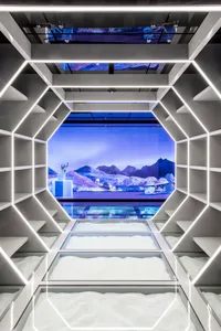 A futuristic showroom with a modern retail storefront showcasing contemporary glass design.