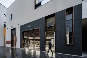 A modern storefront featuring a concrete exterior.