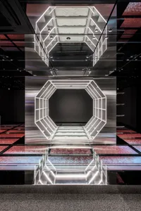 An image featuring a minimalist architectural space with glass features.