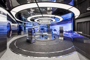 A modern retail shop featuring metallic and glass materials with a futuristic design.