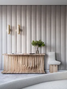 Modern entryway furniture featuring a wooden console table, a potted plant, and a white chair.