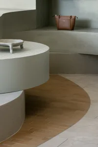 Modern interior space featuring concrete and wooden elements.