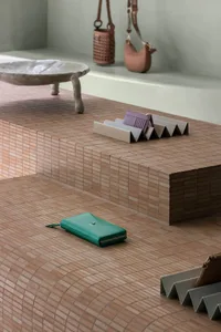 A modern interior design featuring a wooden floor with a wallet placed on it.