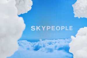 White fluffy clouds against a blue sky background
