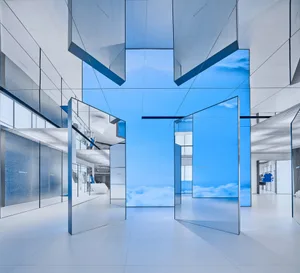 Modern retail storefront with glass walls and ceiling.