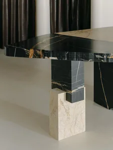Modern, black marble dining table with geometric legs