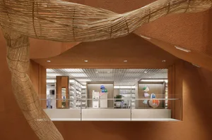 An interior view of a retail shop showcasing wooden windows and shelves.