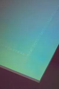 A minimalist display featuring matte black signage.