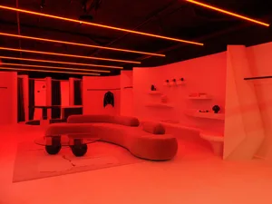 A modern retail space featuring geometric shapes and bright lighting.