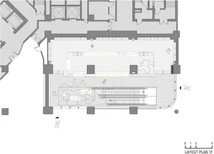 Layout Plan 1F of an office space with desks, chairs, and other office furniture.