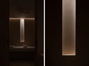 Minimalist interior with accent lighting in a dark room.