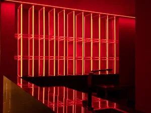 A modern bar interior featuring glass elements.