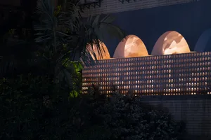 Architectural elements with modern lighting and cement texture.
