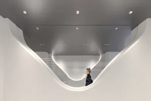 A modern interior space featuring glass and metal materials.