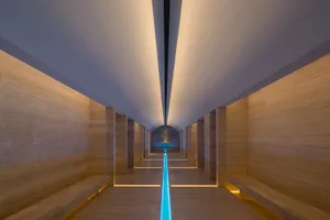 A modern lobby features minimalist concrete design elements.