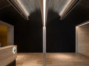 Modern office space featuring metallic, concrete, and brick walls