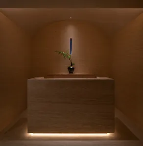 A photo of a modern reception desk made of marble.