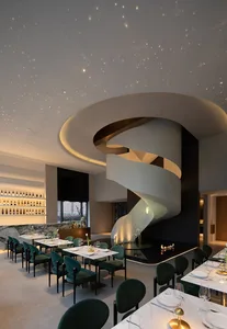 A modern restaurant interior featuring concrete walls and glass elements.