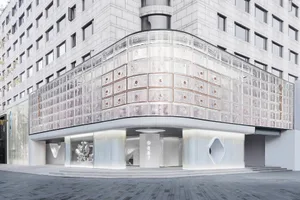 A modern retail storefront featuring glass and metal materials.