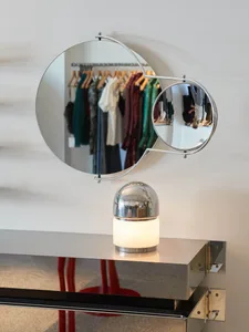 Modern retail shop interior with minimalist design and metallic lighting fixture