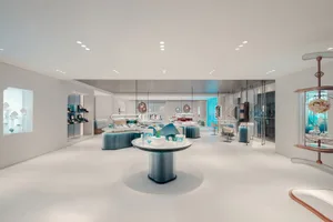 A modern retail interior space featuring glass elements.