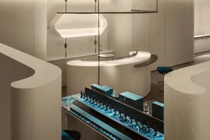 A modern retail storefront featuring marble materials and minimalist design.