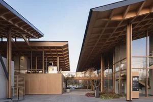 Modern commercial office space featuring wood and glass materials.