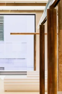 Modern interior featuring marble stairs with metal railings