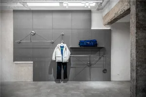 Modern retail store interior with concrete walls and metal structural elements